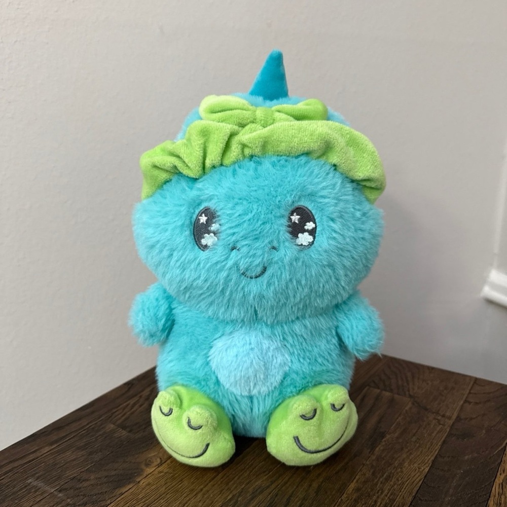 Cute plush wearing little frog slippers